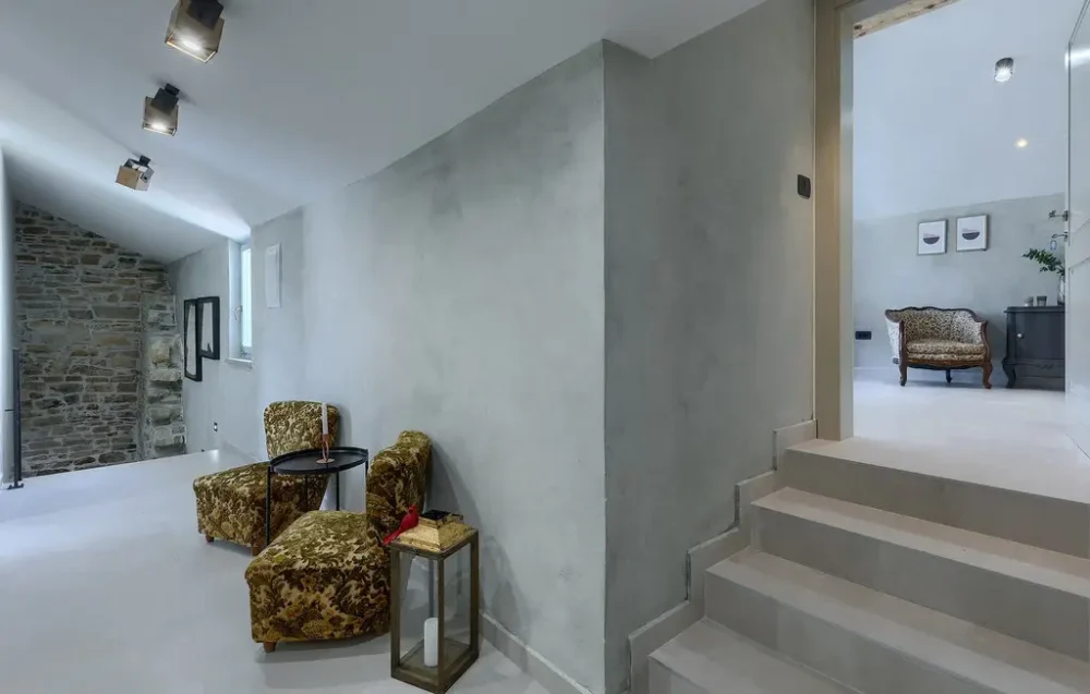 Modern living room with velvet chairs and steps