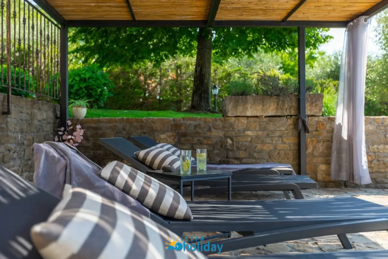 Outdoor patio with lounge chairs and drinks