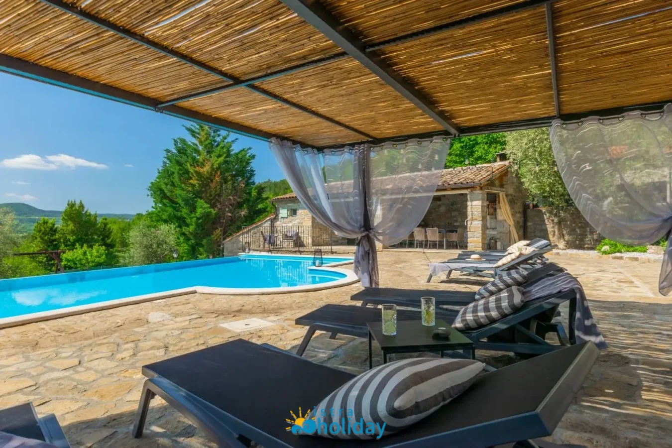 Poolside lounge area with scenic view