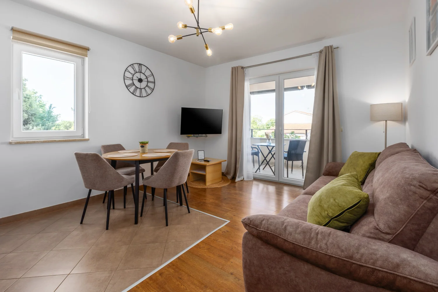 Modern living room with dining area and balcony