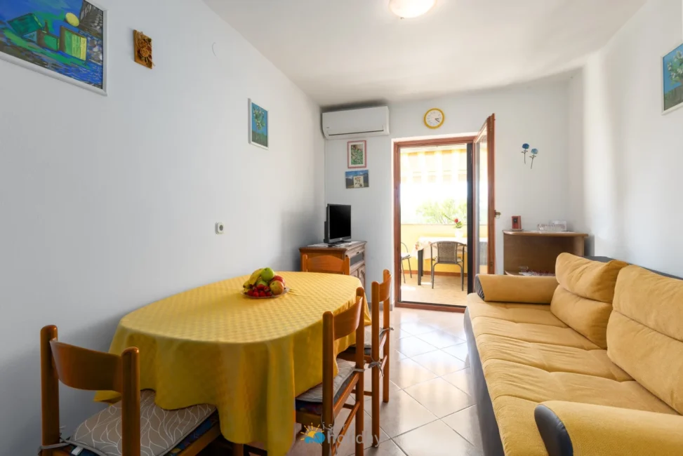 Bright living room with yellow sofa and balcony
