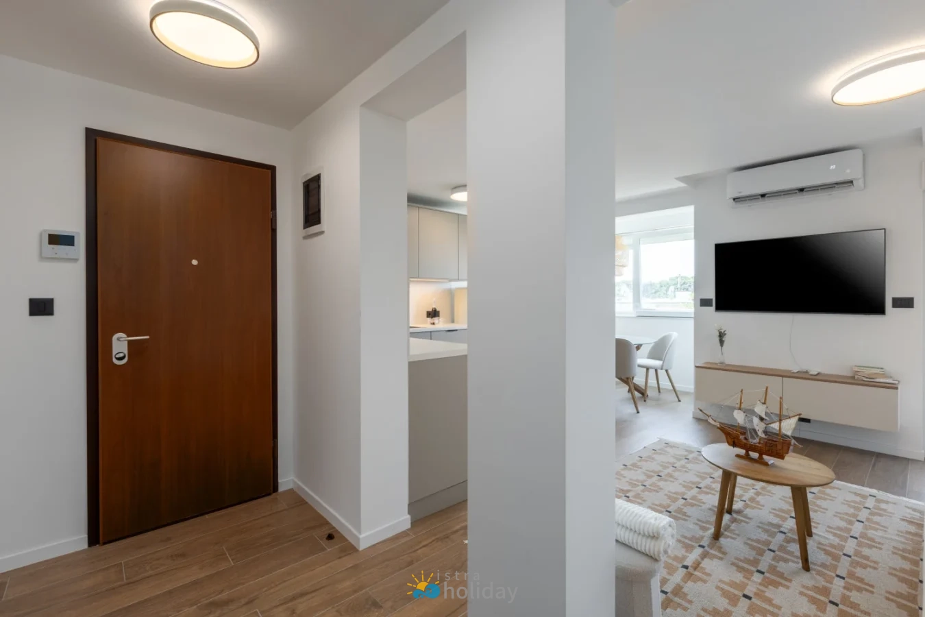 Modern apartment entryway and living room interior