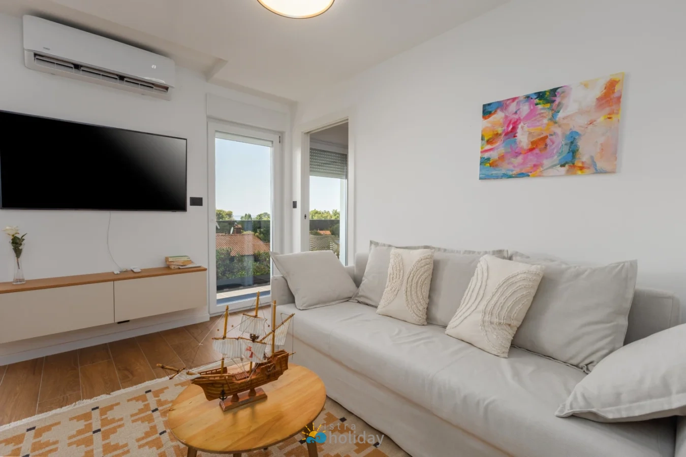 Modern living room with sofa and balcony view
