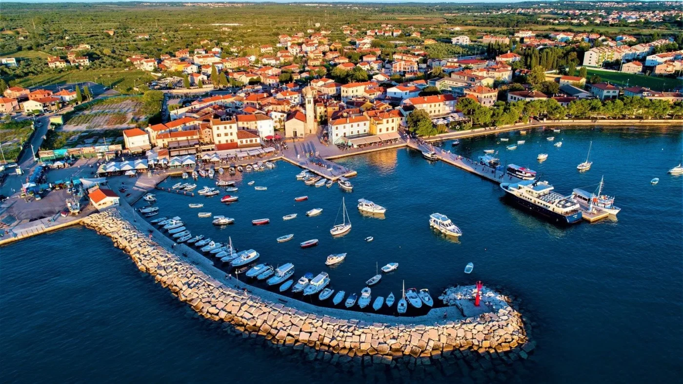 Aerial view of a coastal town harbor.