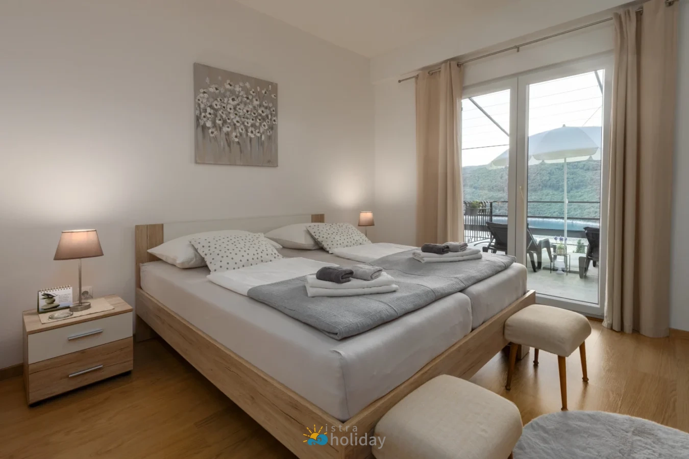 Modern bedroom with balcony and mountain view