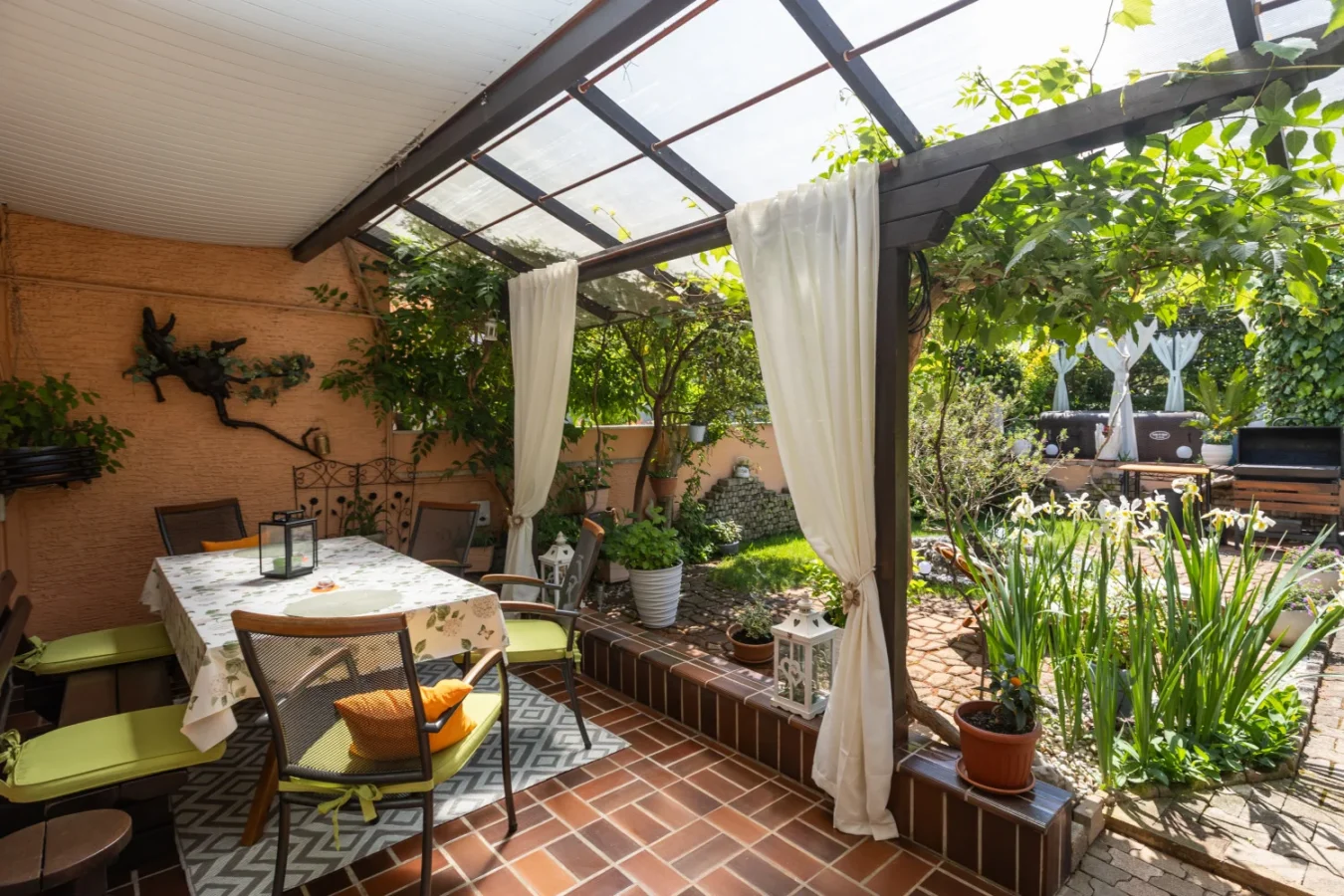 Cozy covered patio with table and garden view