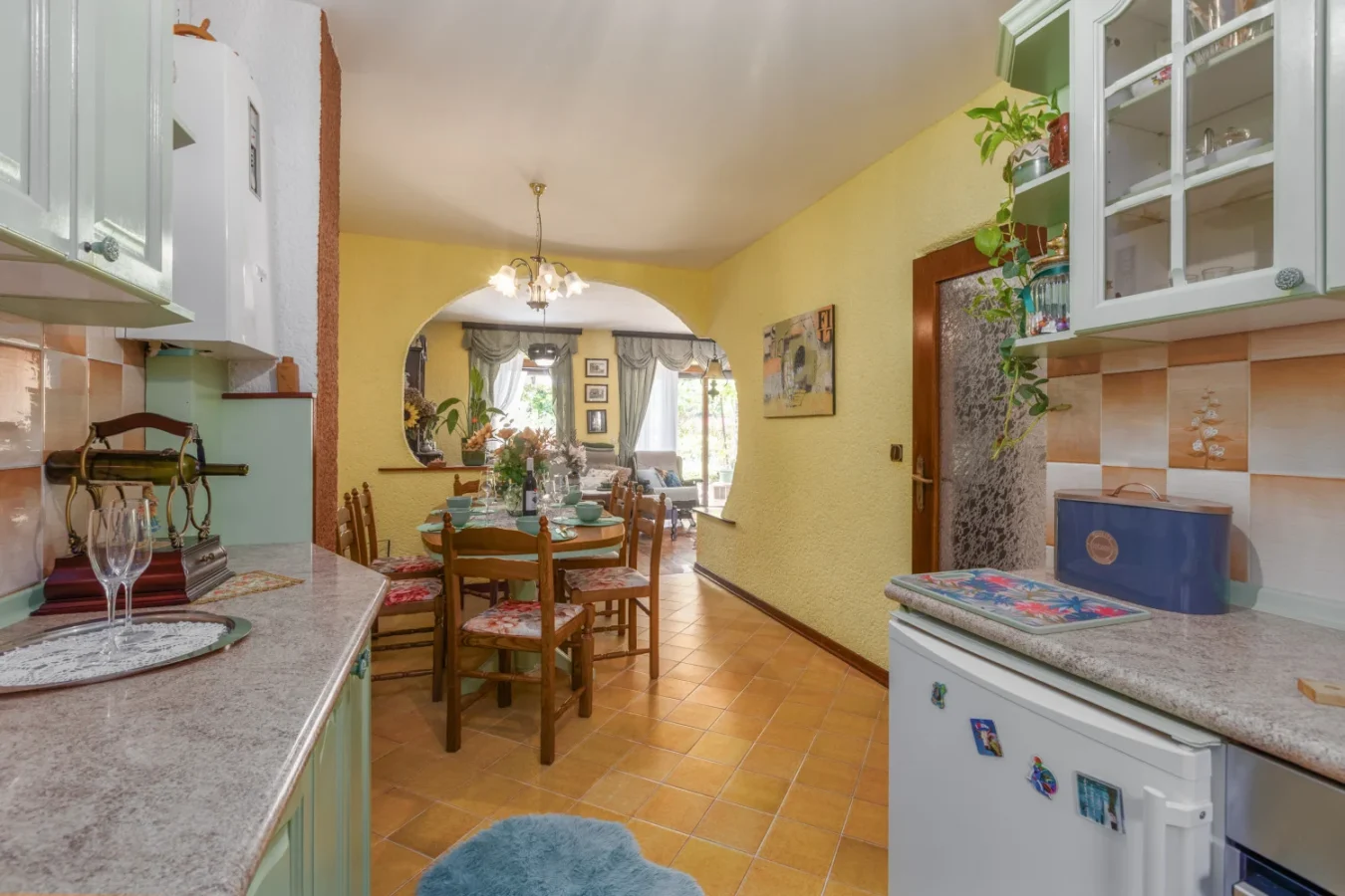 Cozy kitchen and dining area with archway