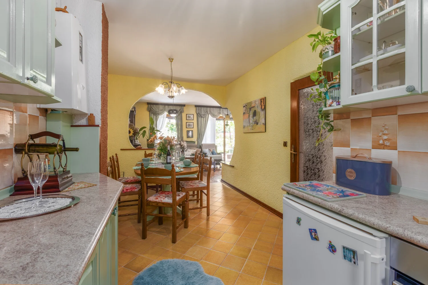 Cozy kitchen and dining area with archway