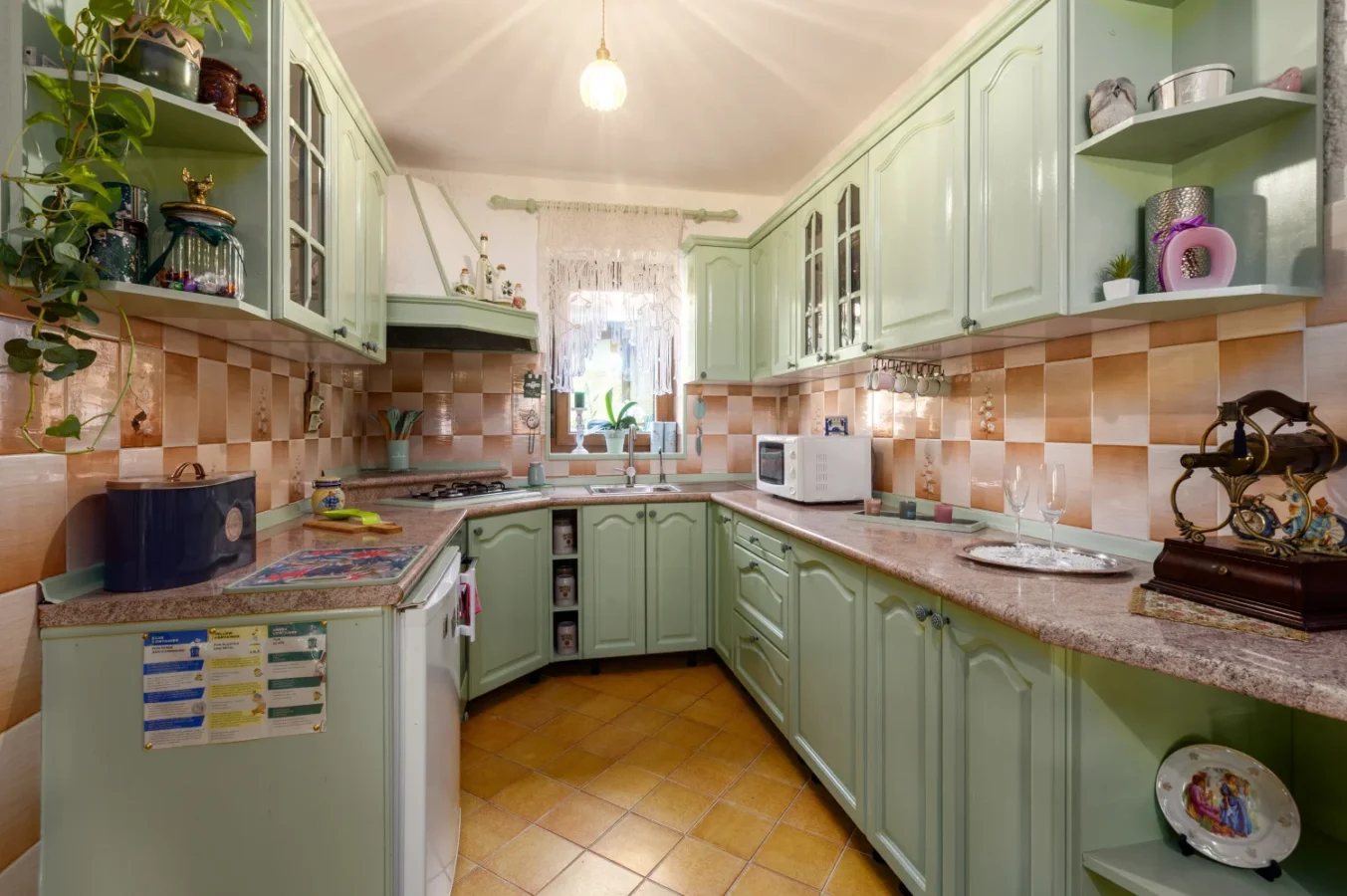 Vintage mint green kitchen with checkered backsplash