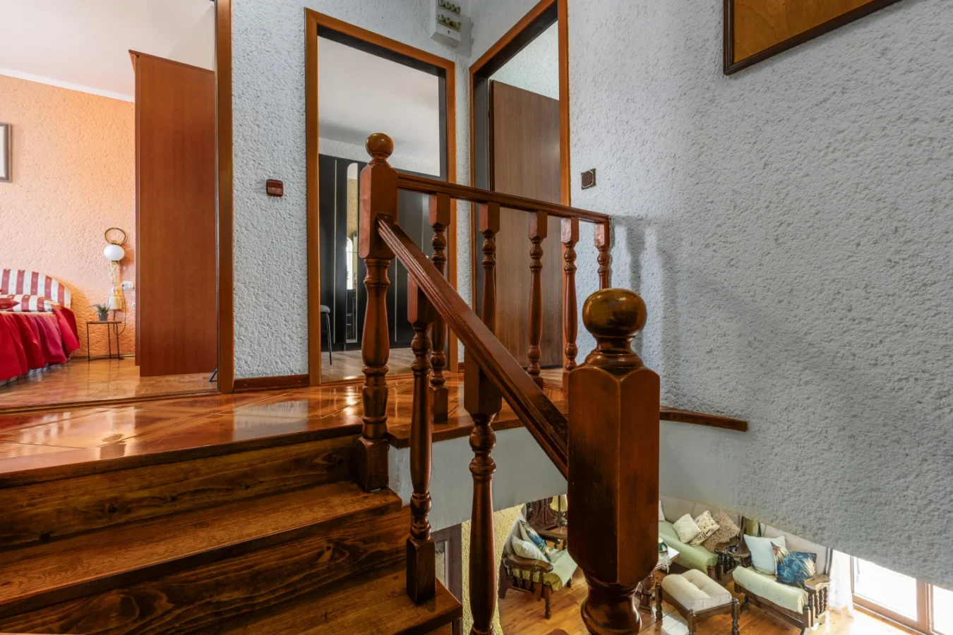 Wooden staircase with banister in cozy home interior