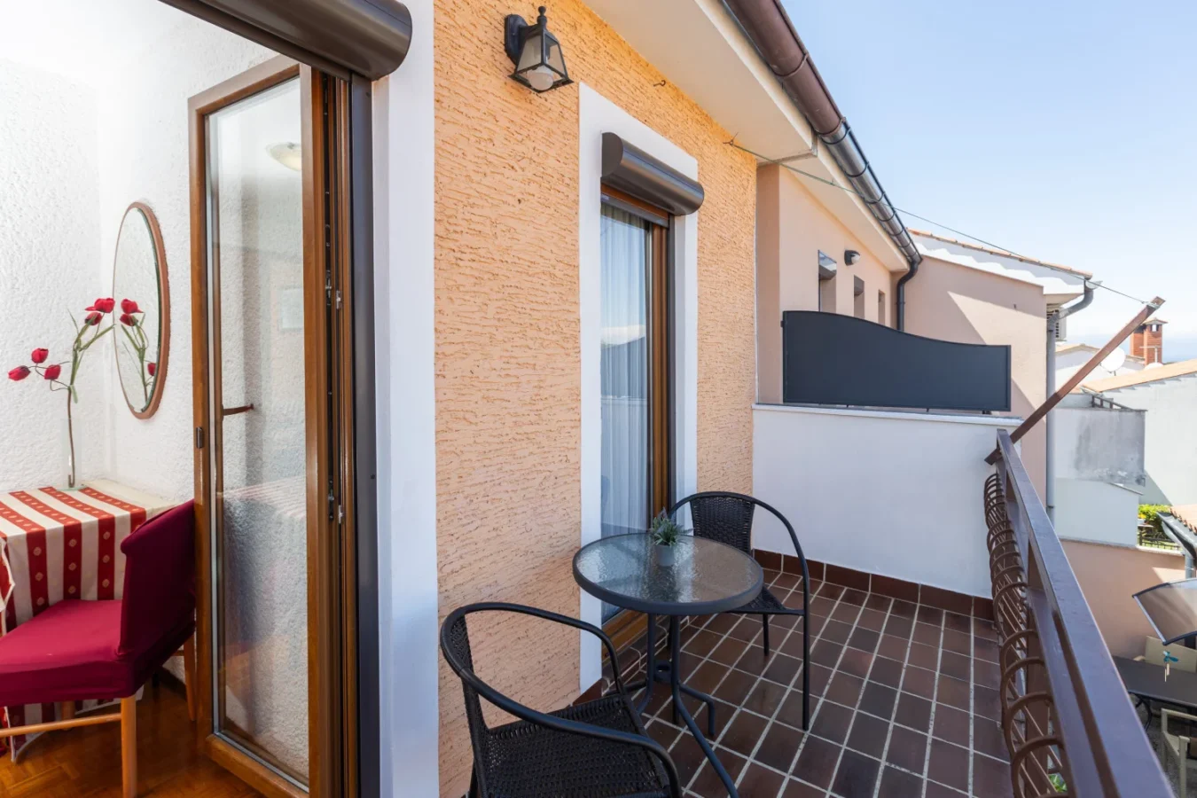 Small balcony with table and two chairs