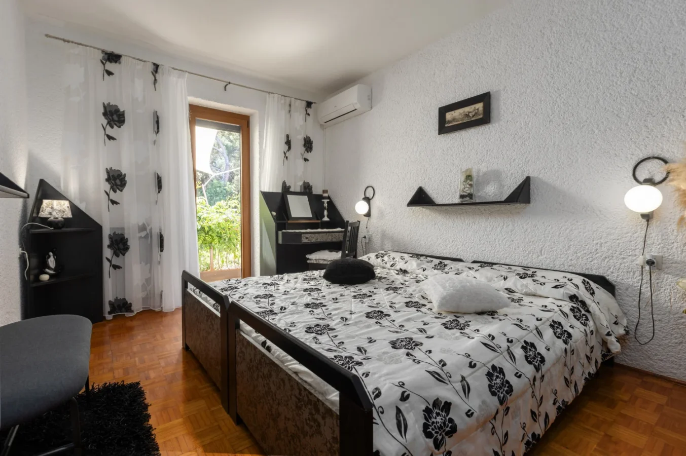 Cozy bedroom with black and white floral bedding
