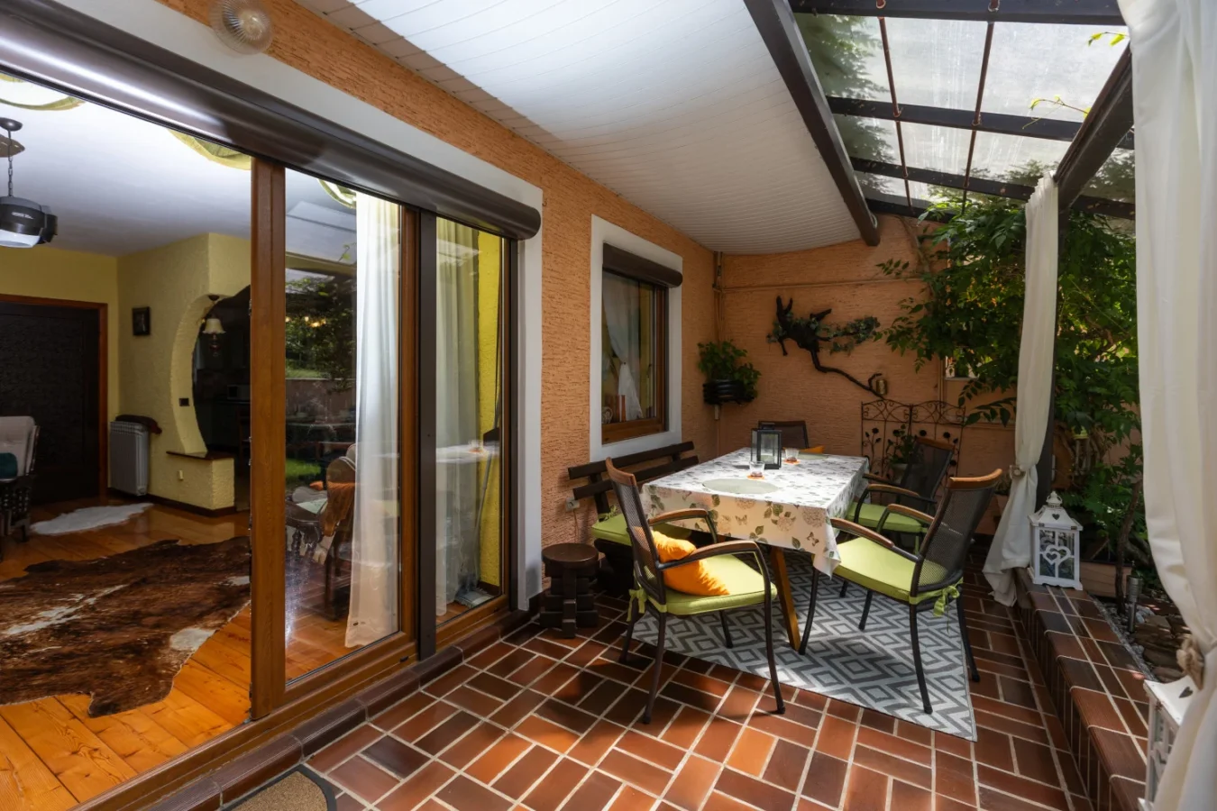 Cozy covered patio with table and chairs