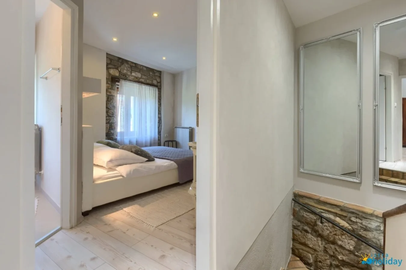 Cozy bedroom with stone accents and modern decor