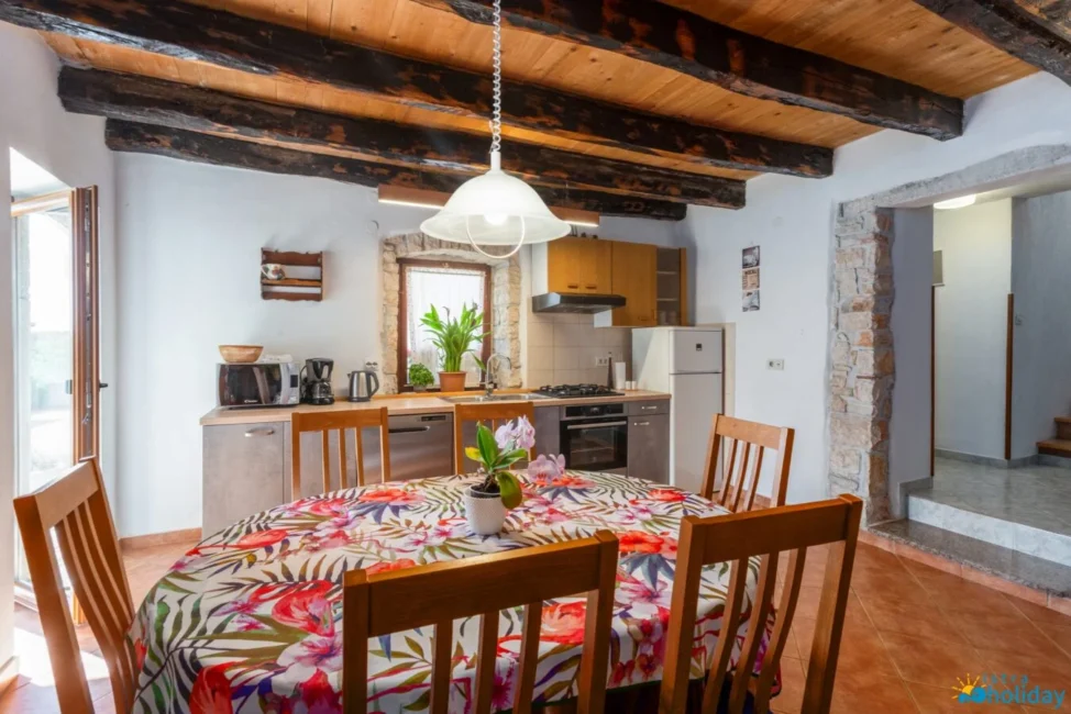 Rustic kitchen with colorful floral tablecloth