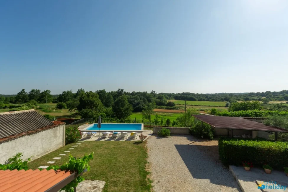 Countryside view with pool and green landscape